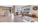 Bright living area with a dining space, large windows and neutral color palette at 3024 Living Coral St, Wimauma, FL 33598