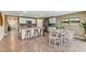 Spacious open concept kitchen and dining featuring granite countertops and modern appliances at 3024 Living Coral St, Wimauma, FL 33598