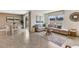 Bright living area with a dining space, large windows and neutral color palette at 3024 Living Coral St, Wimauma, FL 33598