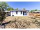 Open backyard with a fence, perfect for outdoor activities and entertaining at 3205 E North Bay St, Tampa, FL 33610