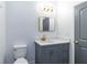 Bathroom featuring modern fixtures, stylish vanity, and ample lighting at 3205 E North Bay St, Tampa, FL 33610