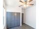 Simple bedroom with a closet, ceiling fan, and a neutral color scheme at 3205 E North Bay St, Tampa, FL 33610