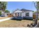 Charming single-story home featuring a covered porch and neatly maintained front yard at 3205 E North Bay St, Tampa, FL 33610