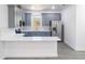Stylish kitchen with gray cabinetry, subway tile backsplash, and stainless steel appliances at 3205 E North Bay St, Tampa, FL 33610