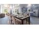 Bright and spacious living space flowing into the dining area and featuring an open-concept kitchen at 3205 E North Bay St, Tampa, FL 33610