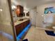 Bathroom featuring double vanity, granite counters, and updated lighting at 321 Parkside Ln, Safety Harbor, FL 34695