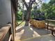 Cabana grill area with stone facade, table, and bench for outdoor cooking at 321 Parkside Ln, Safety Harbor, FL 34695