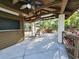 Cabana interior with ceiling fans, lighting, tables, and chairs for entertaining at 321 Parkside Ln, Safety Harbor, FL 34695