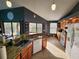 Spacious kitchen with granite countertops, stainless steel appliances, and an eat-in bar at 321 Parkside Ln, Safety Harbor, FL 34695