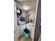 Small laundry room with washer, dryer, overhead shelf and hot water heater at 321 Parkside Ln, Safety Harbor, FL 34695