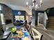 Cozy living room with dining area, fireplace, chandelier, and lots of light at 321 Parkside Ln, Safety Harbor, FL 34695