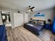 Main bedroom featuring wood-look flooring, ample storage, and calming color palette at 321 Parkside Ln, Safety Harbor, FL 34695