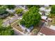 Neighborhood home with mature trees, showing the property's location in a residential community at 3413 N 12Th St, Tampa, FL 33605