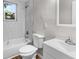 Bathroom featuring tiled shower, modern vanity, and toilet at 3413 N 12Th St, Tampa, FL 33605
