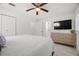 Well-lit bedroom with a ceiling fan and updated flooring, creating a serene living space at 347 Patica Ne Rd, St Petersburg, FL 33702