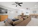 Spacious living room with modern ceiling fans, neutral colors, and comfortable seating at 347 Patica Ne Rd, St Petersburg, FL 33702