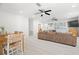 Open-concept living area featuring modern finishes and a smooth transition to the dining area at 347 Patica Ne Rd, St Petersburg, FL 33702