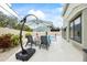 Relaxing backyard oasis with lounge chairs and umbrella adjacent to the beautiful pool at 400 Westborough Ln, Safety Harbor, FL 34695