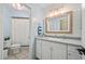 Bright bathroom with white vanity, modern fixtures, shiplap accent wall and shower at 400 Westborough Ln, Safety Harbor, FL 34695
