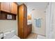 This bathroom includes a shower, vanity, and wooden cabinets for ample storage at 400 Westborough Ln, Safety Harbor, FL 34695