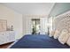 Bedroom featuring stylish decor, views of pool, and wood floors at 400 Westborough Ln, Safety Harbor, FL 34695