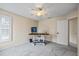 Bedroom with ceiling fan, window with blinds, and desk area for a work space at 400 Westborough Ln, Safety Harbor, FL 34695