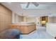 Expansive bonus room with custom built-ins, skylights, and a comfortable seating area at 400 Westborough Ln, Safety Harbor, FL 34695