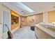 Bonus room with natural light, guitar display, comfortable seating, and custom built-ins at 400 Westborough Ln, Safety Harbor, FL 34695