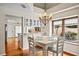 Inviting dining area with hardwood floors and stylish lighting, perfect for Gathering meals at 400 Westborough Ln, Safety Harbor, FL 34695