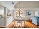 Bright dining room featuring hardwood floors, and a charming chandelier at 400 Westborough Ln, Safety Harbor, FL 34695