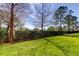 Backyard with green grass and lush hedge, providing privacy at 4676 66Th N Pl, Pinellas Park, FL 33781
