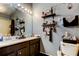 Spacious bathroom with double sinks, vanity, and organized decor shelves at 4676 66Th N Pl, Pinellas Park, FL 33781