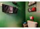 Full bathroom view, showcasing toilet and decorative towel rack and basket at 4676 66Th N Pl, Pinellas Park, FL 33781