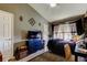 Bedroom featuring a large bed, chest of drawers, and decorative decor at 4676 66Th N Pl, Pinellas Park, FL 33781