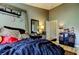 Bedroom features a bed and desk and gives access to the bathroom at 4676 66Th N Pl, Pinellas Park, FL 33781