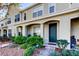 Attractive townhome with a well-maintained lawn and a covered entry, ensuring curb appeal at 4676 66Th N Pl, Pinellas Park, FL 33781