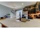 Bright kitchen boasts a large center island with marble countertops, a stylish sink, and black cabinets with modern appliances at 4676 66Th N Pl, Pinellas Park, FL 33781
