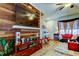 Stylish living area with a media center, wood-look floors, and comfortable seating arrangements at 4676 66Th N Pl, Pinellas Park, FL 33781