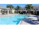 Community pool area featuring comfortable lounge chairs and inviting outdoor spaces, perfect for relaxation at 4676 66Th N Pl, Pinellas Park, FL 33781