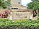 Welcoming entrance sign for Sawgrass Village, beautifully landscaped and showcasing community pride at 4676 66Th N Pl, Pinellas Park, FL 33781