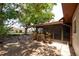A partially shaded backyard with a screened-in porch, perfect for relaxing outdoors at 4812 Wynwood Dr, Tampa, FL 33615