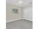 Bedroom with window featuring closet with bifold doors and neutral walls at 4812 Wynwood Dr, Tampa, FL 33615