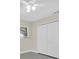 Bedroom with window featuring closet with bifold doors and neutral walls at 4812 Wynwood Dr, Tampa, FL 33615