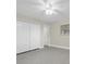 This bedroom offers a large closet, window, and polished concrete floors for a modern touch at 4812 Wynwood Dr, Tampa, FL 33615