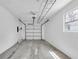 Clean, bright garage with a working door, epoxy flooring, and an automatic garage door opener at 4812 Wynwood Dr, Tampa, FL 33615