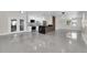 Open-concept kitchen with an island, stainless appliances, and easy access to living area and patio at 4812 Wynwood Dr, Tampa, FL 33615