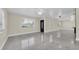 Spacious living room with plenty of natural light and modern polished concrete floors at 4812 Wynwood Dr, Tampa, FL 33615