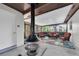 Cozy enclosed patio featuring comfortable seating and a unique overhead vent at 4812 Wynwood Dr, Tampa, FL 33615