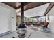 Relaxing sun room with black fireplace, wicker seating, and floral rug at 4812 Wynwood Dr, Tampa, FL 33615