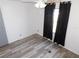 Empty bedroom with dark curtains, featuring a ceiling fan and laminate flooring at 5244 Betty St, Zephyrhills, FL 33542
